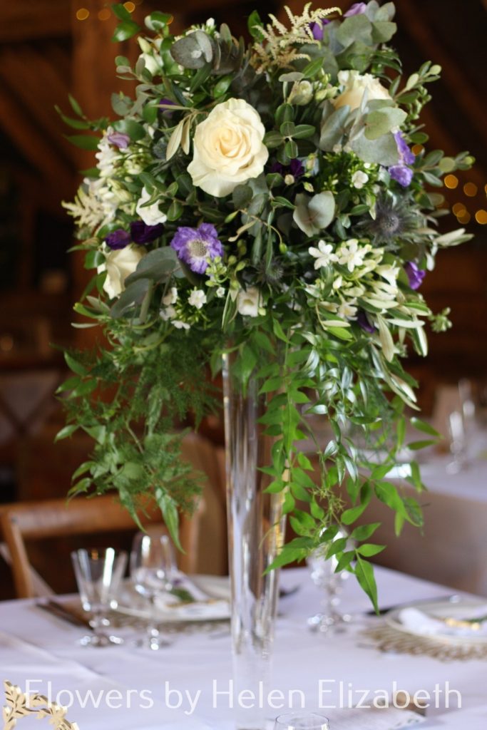 A picture containing table, flower, vase at Silchester Farm